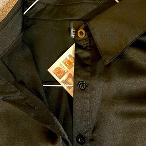 Black long sleeved button front blouse